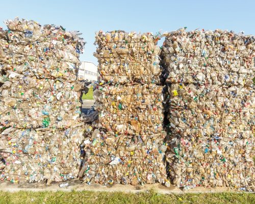 Plastic bales of rubbish at the waste treatment processing plant. Recycling separatee and storage of garbage for further disposal, trash sorting. Business for sorting and processing of waste. Plastic bales of rubbish at the waste treatment processing plant. Recycling separatee and storage of garbage for further disposal, trash sorting. Business for sorting and processing of waste.
